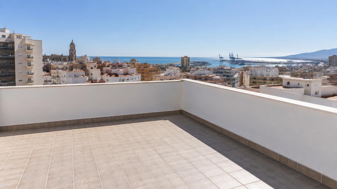 Before: Málaga roof terrace before and after solar panels and a heat pump were installed